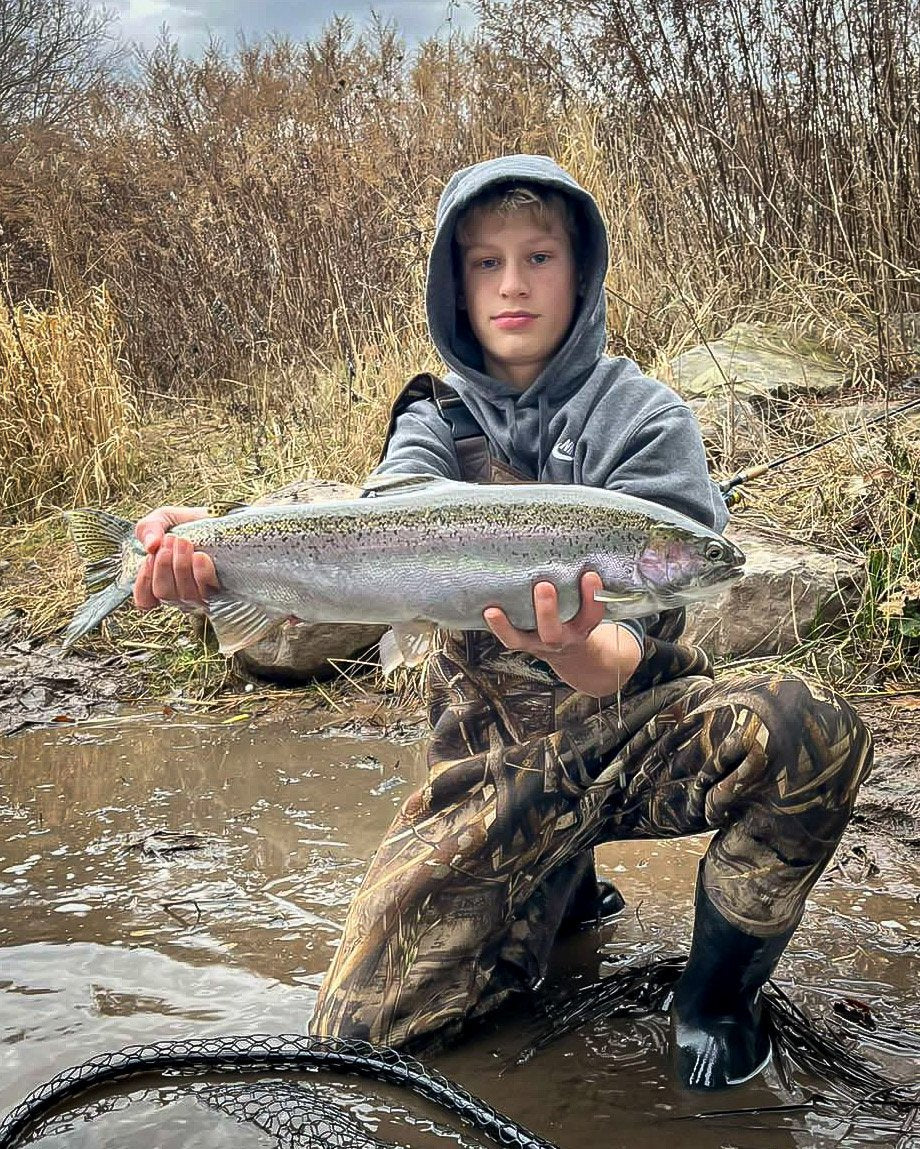 Amateur Fishing Kid with Trophy Catch